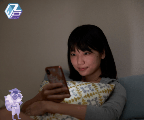 Social work student studying for ASWB exam using digital prep app and study notes